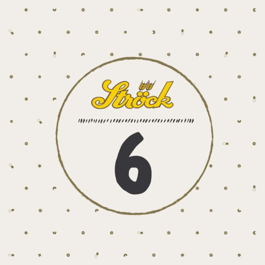Ein beiger Hintergrund mit kleinen verstreuten Symbolen umgibt einen goldumrandeten Kreis. Im Inneren erscheint das gelbe "Ströck"-Logo über einer großen schwarzen Zahl 6.