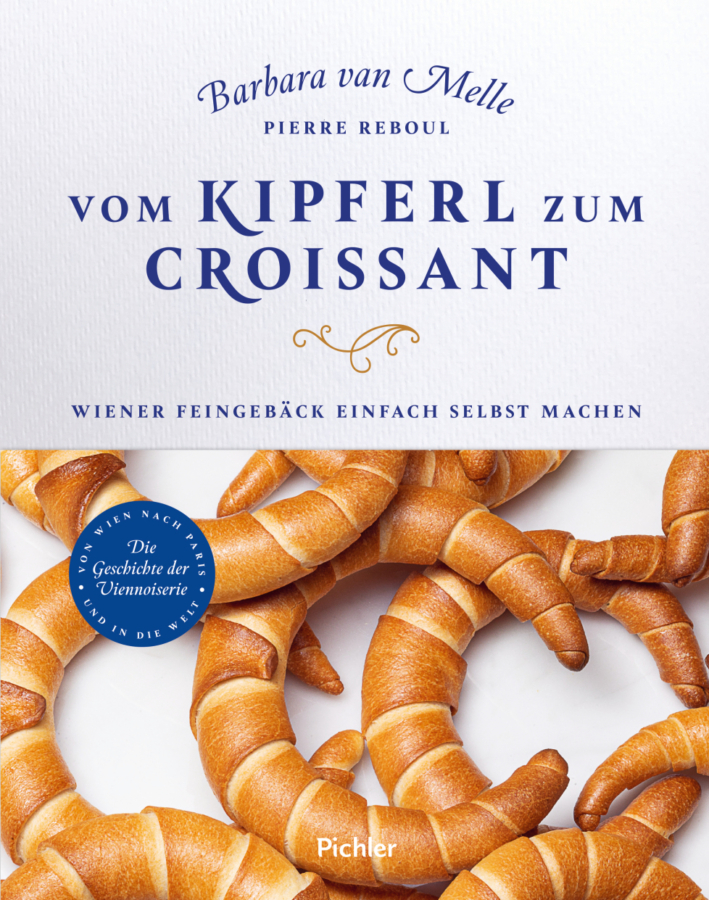 Buchumschlag mit dem Titel Vom Kipferl zum Croissant von Barbara van Melle und Pierre Reboul. Der Umschlag zeigt mehrere goldbraune halbmondförmige Gebäckstücke und blauen Text auf weißem Hintergrund.